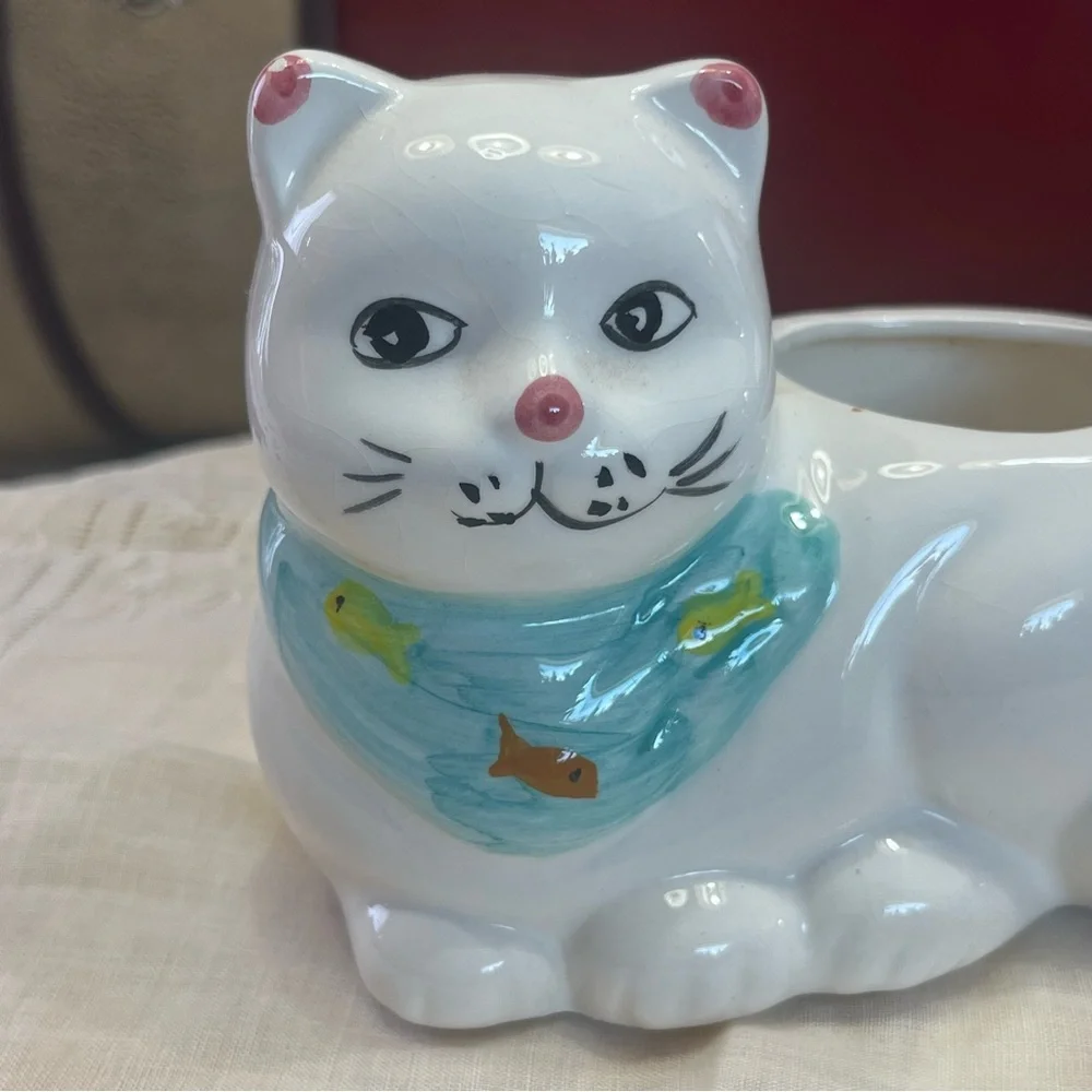 White Ceramic Cat-Shaped Planter with a Blue Scarf Adorned with Fish.